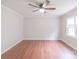 Bright bedroom with a ceiling fan, window, and sleek hardwood floors at 212 Pine St, Rockwell, NC 28138