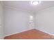 Bedroom featuring neutral paint, wood floors, and a side entrance at 212 Pine St, Rockwell, NC 28138