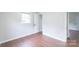 Bright bedroom with hardwood floors, closet and window at 212 Pine St, Rockwell, NC 28138