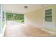 Covered carport area with ample space and access to an exterior door at 212 Pine St, Rockwell, NC 28138