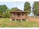 Quaint home with trees and landscaping at 212 Pine St, Rockwell, NC 28138