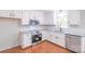 Well-lit kitchen with stainless steel appliances, granite counters, and white cabinets at 212 Pine St, Rockwell, NC 28138