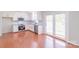 Spacious eat-in kitchen with stainless steel appliances, granite countertops, and white cabinets at 212 Pine St, Rockwell, NC 28138
