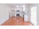Bright room with hardwood floors, double doors, and a separate exterior access door at 212 Pine St, Rockwell, NC 28138