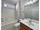 Bathroom with shower, bathtub, updated vanity and fixtures at 2163 Woodstream Rd, Harrisburg, NC 28075