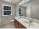 Bathroom features double sinks with a large vanity mirror and a window at 2163 Woodstream Rd, Harrisburg, NC 28075