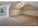 Bright bonus room with carpet, two ceiling fans and a window for natural light at 2163 Woodstream Rd, Harrisburg, NC 28075