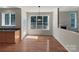 Breakfast nook with large windows offering outdoor views and access to the deck at 2163 Woodstream Rd, Harrisburg, NC 28075