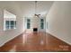 Bright living room features tall ceilings, gas fireplace, and beautiful hardwood floors at 2163 Woodstream Rd, Harrisburg, NC 28075
