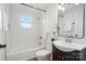 Updated bathroom with white subway tile, dark vanity, and modern fixtures at 224 Adrian St, Mount Holly, NC 28120