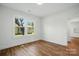 Bedroom with wood floors, bright natural light, and neutral wall color at 224 Adrian St, Mount Holly, NC 28120