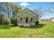 Charming green bungalow with a welcoming front porch and well-manicured lawn at 224 Adrian St, Mount Holly, NC 28120