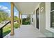 A perspective of the front porch highlighting its wooden pillars and classic design at 224 Adrian St, Mount Holly, NC 28120