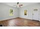 A bright room with hardwood floors, white walls, and plenty of natural light at 224 Adrian St, Mount Holly, NC 28120