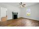 Bright living room with hardwood floors and a classic fireplace at 224 Adrian St, Mount Holly, NC 28120