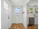 Convenient mudroom area leading to the kitchen, with a laundry hook-up and natural light at 224 Adrian St, Mount Holly, NC 28120