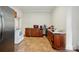 Traditional kitchen with tile flooring, wood cabinets, and modern appliances at 247 W Park Ave, Charlotte, NC 28203