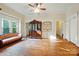 Charming living room with hardwood floors, vintage furniture, and built-in shelving showcasing a classic design at 247 W Park Ave, Charlotte, NC 28203