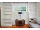 Bright living room featuring built-in bookshelves and a window offering plenty of natural light at 247 W Park Ave, Charlotte, NC 28203