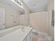 Well-lit bathroom with a large mirror and shower with curtains at 253 Memory Ln, Rock Hill, SC 29732