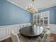 Beautiful dining room featuring an elegant chandelier, wide window, and ample space at 253 Memory Ln, Rock Hill, SC 29732