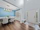 Elegant dining room with a modern chandelier, hardwood floors, and large windows at 253 Memory Ln, Rock Hill, SC 29732