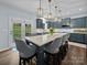 Kitchen area featuring a spacious island with seating and modern appliances at 253 Memory Ln, Rock Hill, SC 29732
