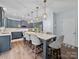 Beautiful eat-in kitchen featuring blue cabinets, pendant lighting, and stainless steel appliances at 253 Memory Ln, Rock Hill, SC 29732