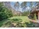 Manicured backyard with lawn and greenery, set alongside deck at 3005 Dream Catcher Cir, Fort Mill, SC 29715
