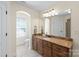 Bathroom featuring a granite countertop, wood cabinets, and a neutral color palette at 3005 Dream Catcher Cir, Fort Mill, SC 29715
