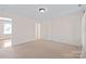 Spacious bedroom with neutral carpet and paint, and a view into the next room at 3005 Dream Catcher Cir, Fort Mill, SC 29715