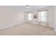 Bright bedroom with plush carpet, neutral walls, and windows dressed with light curtains at 3005 Dream Catcher Cir, Fort Mill, SC 29715
