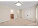 Bedroom with neutral carpet, large closet, and a doorway view into an attached bathroom at 3005 Dream Catcher Cir, Fort Mill, SC 29715