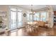 Sunlit dining room with a table, chairs, and French doors leading to the outside at 3005 Dream Catcher Cir, Fort Mill, SC 29715