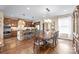 Spacious dining room with hardwood floors, a large table, and access to the kitchen at 3005 Dream Catcher Cir, Fort Mill, SC 29715
