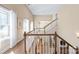 Bright foyer featuring a staircase, hardwood floors, and large windows with natural light at 3005 Dream Catcher Cir, Fort Mill, SC 29715