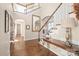 Stunning foyer with wood floors, a large mirror, and staircase leading to the upper level at 3005 Dream Catcher Cir, Fort Mill, SC 29715