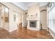 Elegant living room featuring a stone fireplace, high ceilings, and neutral décor at 3005 Dream Catcher Cir, Fort Mill, SC 29715