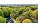 Aerial view of a charming home nestled among lush green trees, offering privacy at 3232 47Th Avenue Ne Pl, Hickory, NC 28601