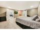 Spacious basement bedroom featuring tile floors, neutral walls, and adjacent living area at 3232 47Th Avenue Ne Pl, Hickory, NC 28601