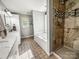 Well-lit bathroom with a separate shower, large tub, tiled floors, and vanity with ample storage at 3232 47Th Avenue Ne Pl, Hickory, NC 28601