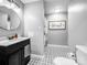 Modern bathroom with sleek vanity, decorative mirror, and patterned tile floor, offering a spa-like experience at 3232 47Th Avenue Ne Pl, Hickory, NC 28601