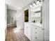 Bright bathroom with double sink vanity, open door to an adjacent room, and modern fixtures at 3232 47Th Avenue Ne Pl, Hickory, NC 28601