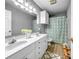 Bright bathroom with double vanity, modern fixtures, and a stylish shower curtain, perfect for Gathering use at 3232 47Th Avenue Ne Pl, Hickory, NC 28601