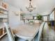 Dining room featuring a wooden table with seating for six and view into the living room at 3232 47Th Avenue Ne Pl, Hickory, NC 28601