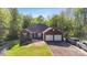 Charming brick home featuring an attached two-car garage and a well-manicured lawn at 3232 47Th Avenue Ne Pl, Hickory, NC 28601