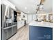 Bright kitchen featuring stainless steel appliances, an island bar and white cabinetry at 3232 47Th Avenue Ne Pl, Hickory, NC 28601