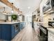 Bright kitchen with white cabinets, stainless steel appliances and a large kitchen island at 3232 47Th Avenue Ne Pl, Hickory, NC 28601