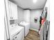 Functional laundry room with washer, dryer, and ample storage space, making laundry chores a breeze at 3232 47Th Avenue Ne Pl, Hickory, NC 28601