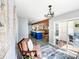 Open-concept living space featuring a modern kitchen island, hardwood floors, and abundant natural light at 3232 47Th Avenue Ne Pl, Hickory, NC 28601